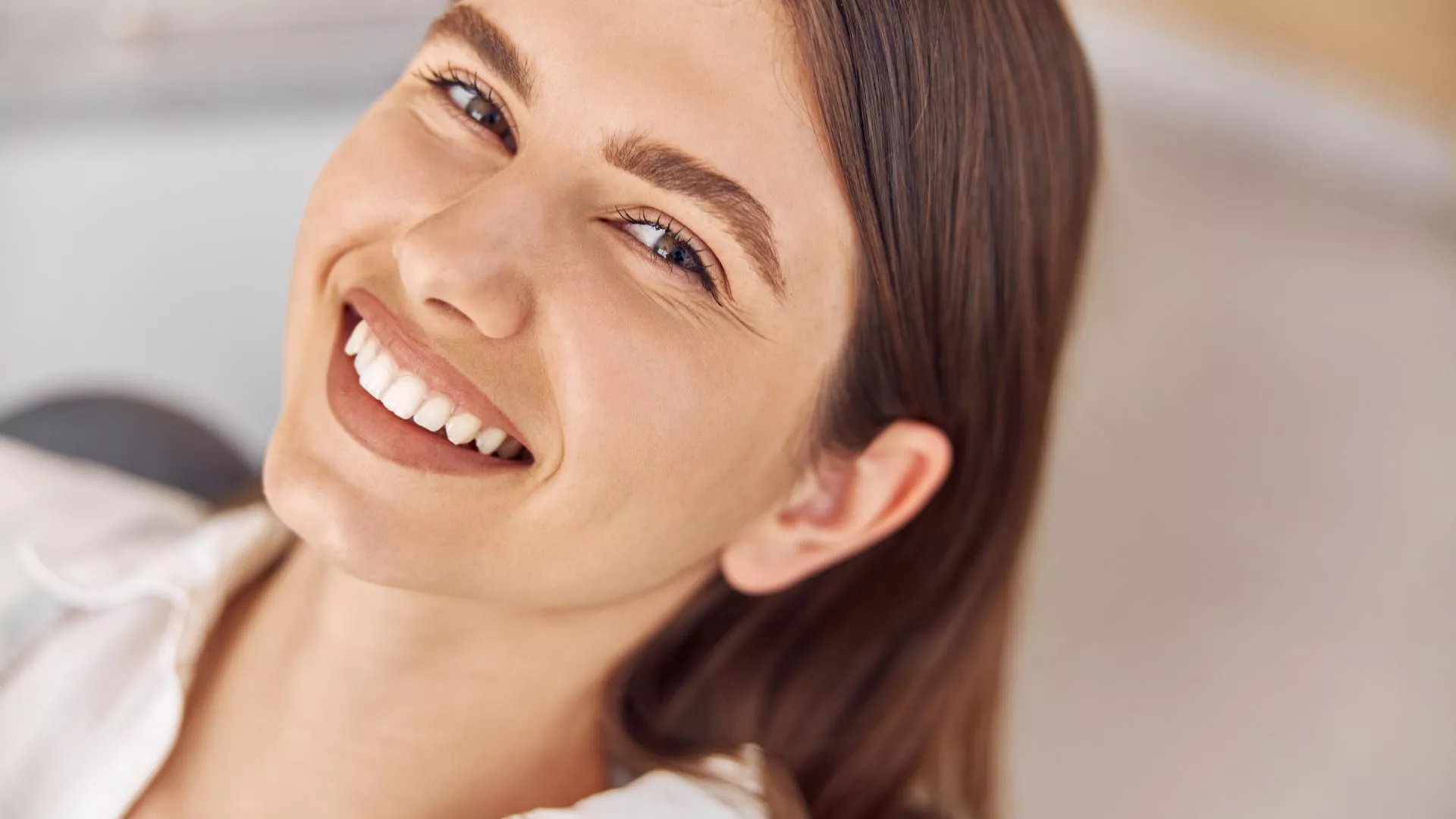 Woman Smiling After Dental Treatment